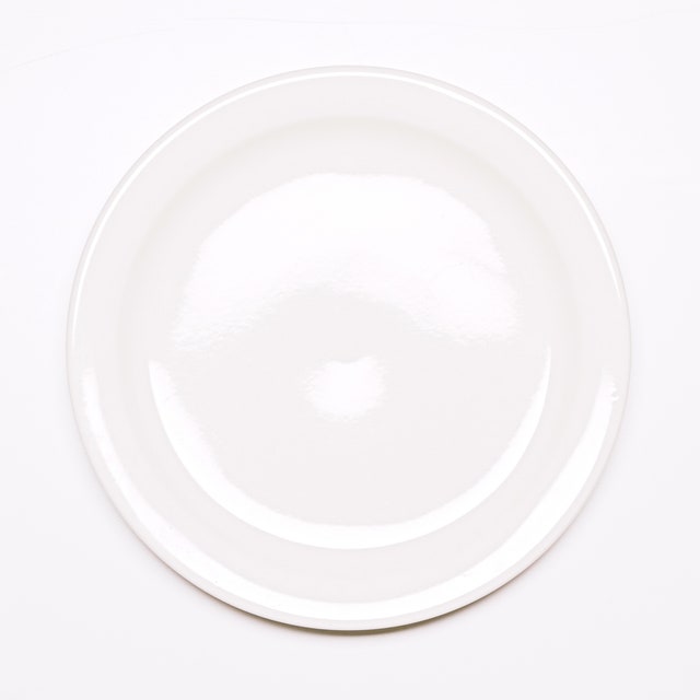 Image may contain Art Pottery Porcelain Saucer Food Dish Meal Drink Milk and Beverage